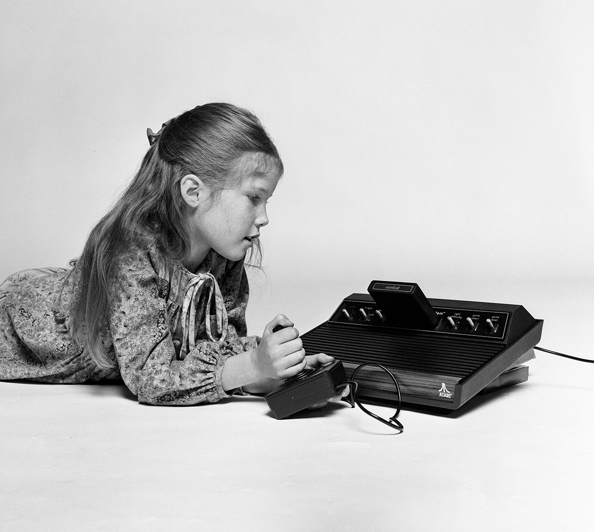 girl playing on the Atari 2600