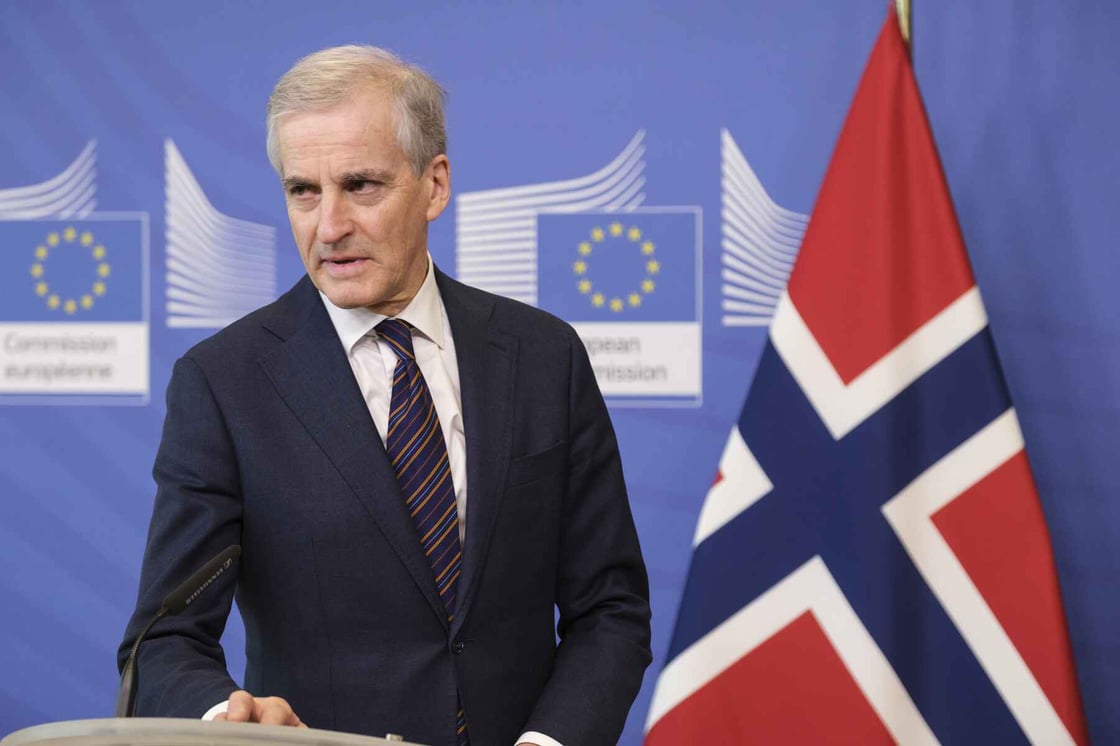 Norwegian Prime Minister Jonas Gahr Store speaks at a podium.