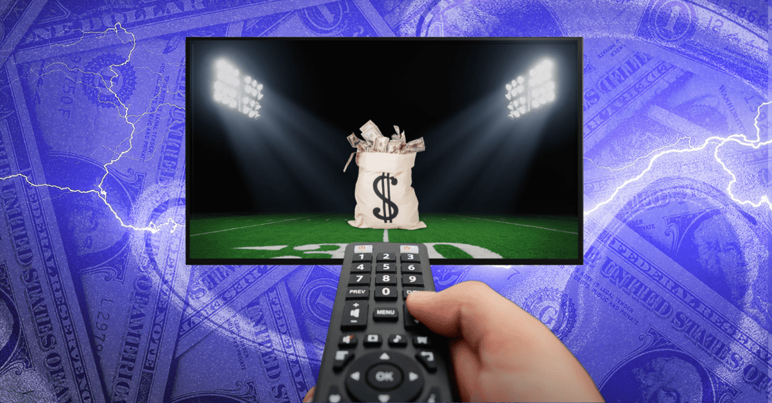 A hand pointing a remote at a TV displaying a bag of money on a football field.