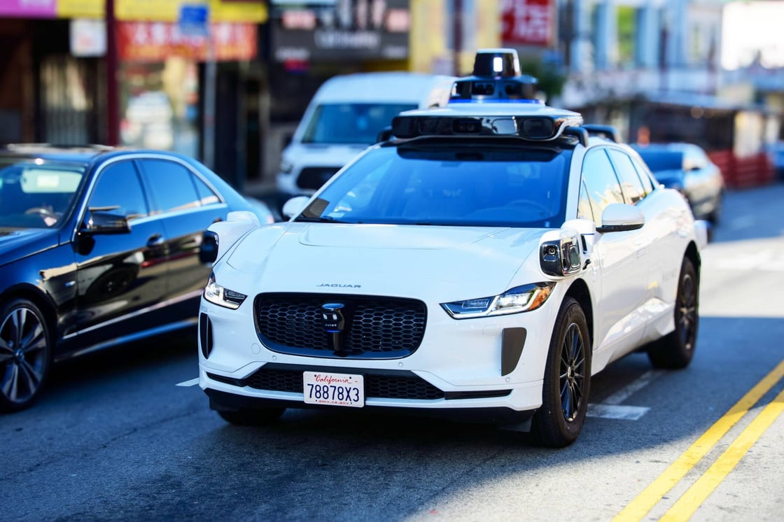 Waymo taxi on the road.