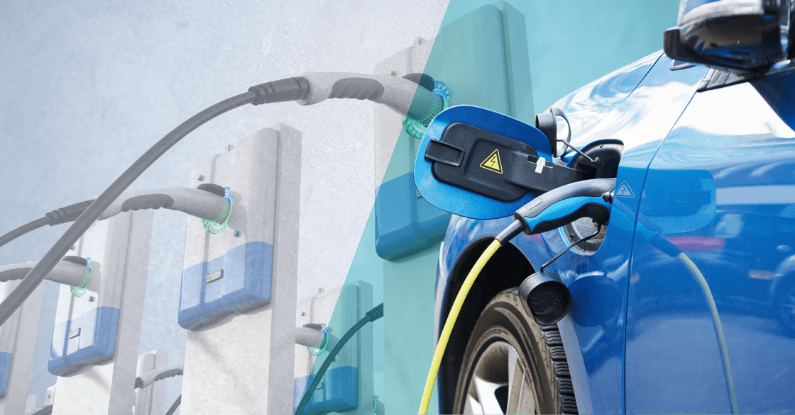 A blue EV charging with charging stations in the background.