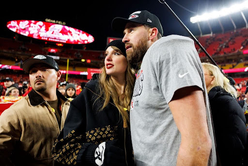 Taylor Swift and Travis Kelce, posing for a picture