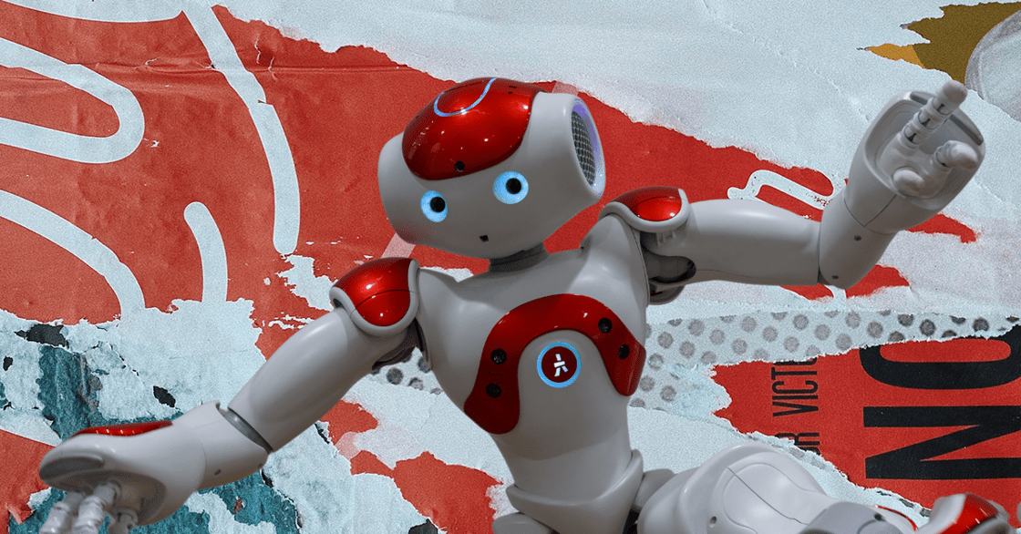 Robot with white body, red accents, blue eyes, against a backdrop of red swirls and white outlines on light blue; right arm raised, left bent.