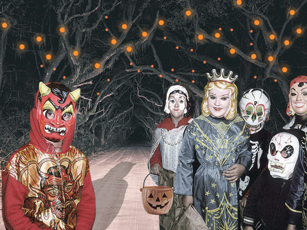 A group of children in various, slightly sinister vintage Halloween costumes, including a red devil, a queen, and several skeletons/ghouls, stand on a dark, tree-lined road.