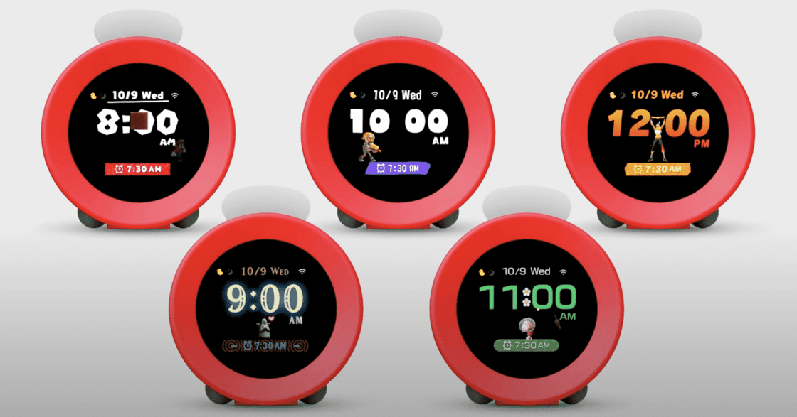 Five round red alarm clocks showing different clockface designs.