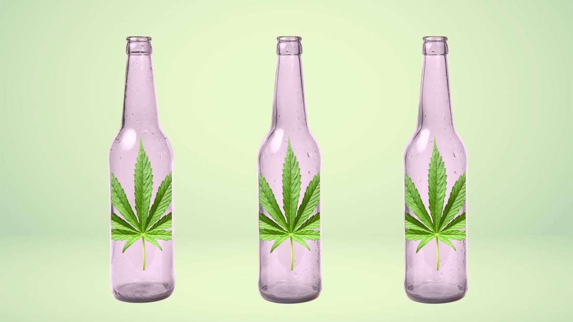 Three glasses bottles, each with a cannabis leaf on it.
